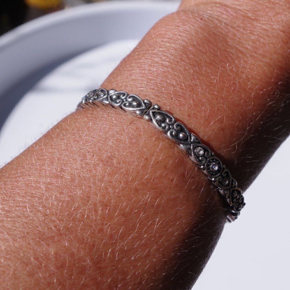 Women`s silver tone stretch bracelet. 2 1/8 inches